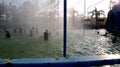 Teenage group of people enjoying holiday in water park.